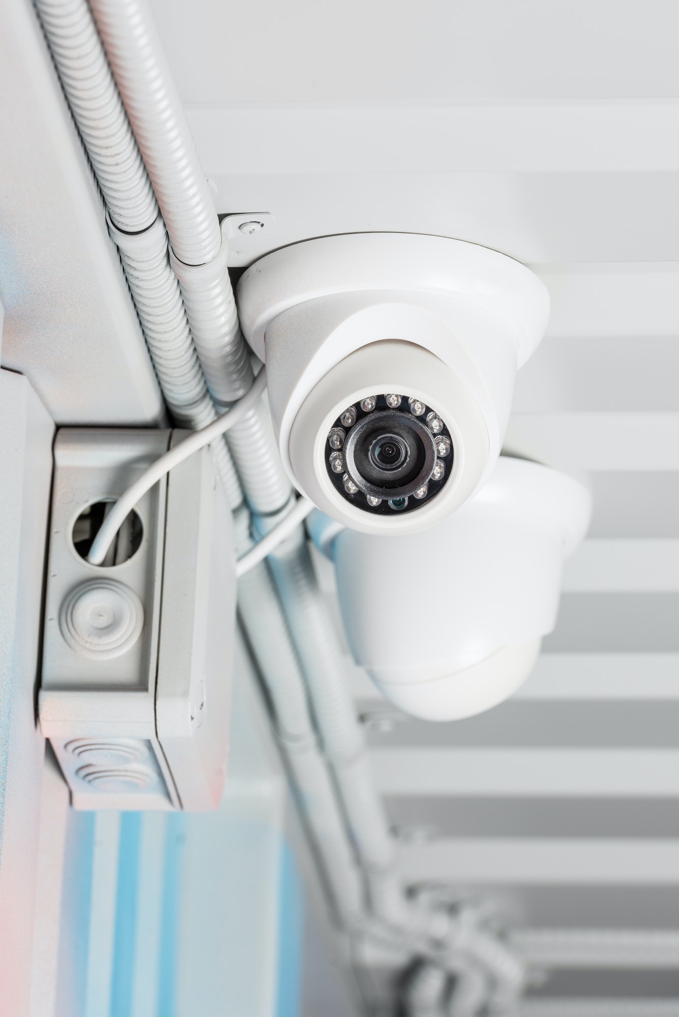 white-security-camera-on-ceiling-home-security-system-concept